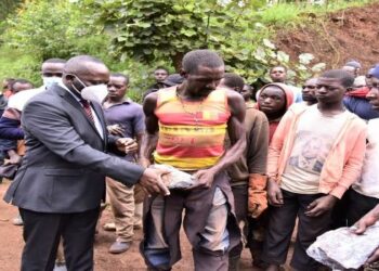 The Leader of the Opposition, Hon Mathias Mpuuga (L) meeting meeting artisan miners at Nakyooga in Kabale district