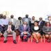 Participants in a group photo at the meeting. Hon. Silas Aogon (seated, centre) is the forum chairperson