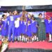 Nakivubo Blue Primary School celebrates with their head teacher and the Director Education and social service on the extreme right.