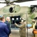 President Museveni chats with Valari Copcin after commissioning into flight the first Soviet Union-Russian type helicopter overhauled in Africa by Pro Heli International Services at Nakasongola. PPU Photo