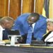 Speaker Among (R) confers with Deputy Attorney General, Hon. Jackson Kafuuzi and Finance State Minister, Hon. Amos Lugoloobi