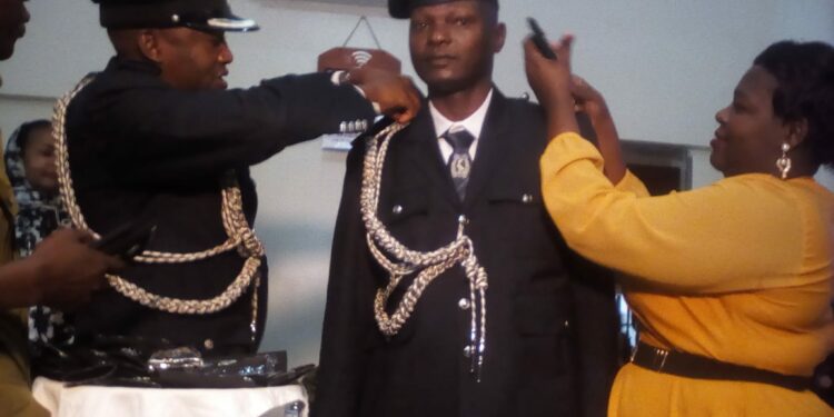 A Police Officer being decorated at Fairway Hotel in Kampala on Thursday