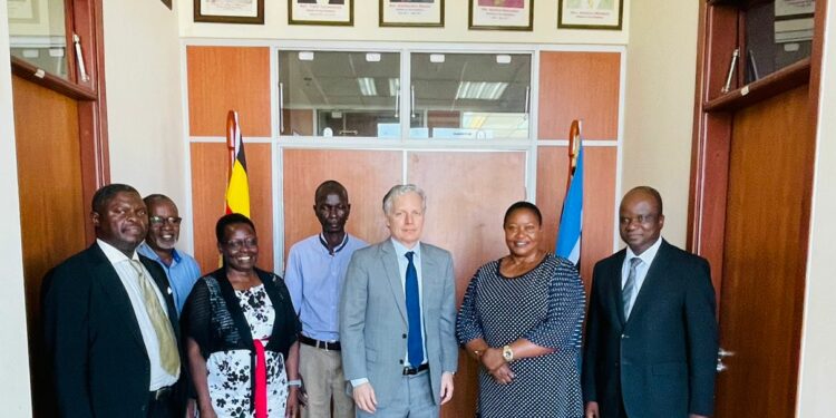 Dr. Nelson Musoba (extreme right) Hon. Babalanda (2nd right) and Mr. Richard Nelson in a group photo with other officials