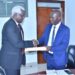 Mr. Kenneth Oluka handing over to Prof. Nangoli Sudi