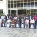 Minister Babalanda,  Hajji Yunus Kakande and Administrative Officers in a group photo.