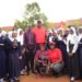 Mumba Kalifungwa, Absa Bank Uganda’s Managing Director (up in a red cap) poses for a photo with students of Highland Secondary School in Kisaasi on Tuesday. Photo@mumbaKalifungwa