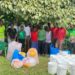 Members of a Community Forest Management group in Nyatonzi subcounty pose with their LC 3 Chairperson in the middle after receiving support and training for Bee Keep from the World Bank Group and Mac Bee trainers