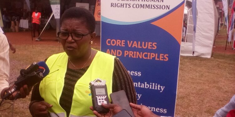 Minister Kasule Lumumba addressing Journalists at KCCA Grounds on Thursday