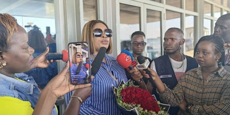 Sinach addressing the press on her arrival at Entebbe International Airport Kampala Uganda