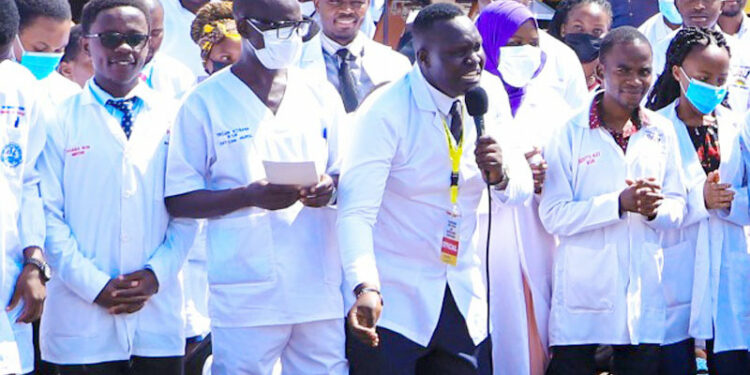 Dr. Samuel Oledo holding the microphone