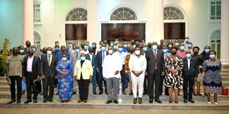 President Museveni in a   group photo with some members of the media after the engagement