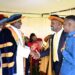 The Deputy Speaker, Thomas Tayebwa (second right) interacting with top university officials and a student (right)