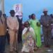 The Won Nyaci- elect HRH Eng Dr Michael Moses Odongo Okune (M) looks on as wife Min-Bangi Margaret Odongo kneels to thank the audience and pledges to serve as Mother of all people of Lango following the election