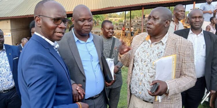 GCW Hon Denis Hamson Obua chats with Prof Willy Okullo of Kyambogo University and Dr Patrick Olet of Gracious Group of Companies after their first meeting for the Coronation Programme.