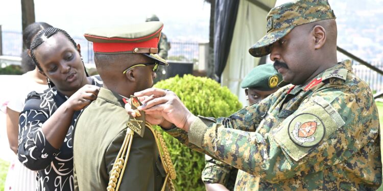 Gen Kainerugaba pipping newly promoted UPDF officers