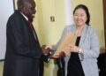 NARO Deputy Director General in charge of Agricultural Technology Promotion, Dr. Sadik Kassim gifting the KOICA Country Director Jihee Ahn after the meeting Entebbe.