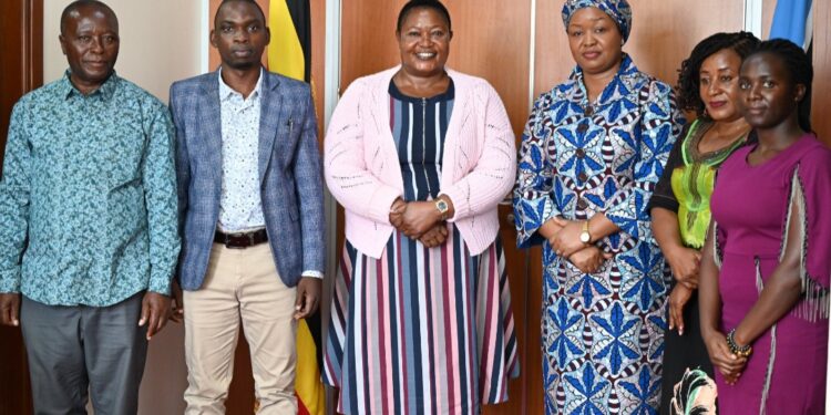 Hon. Babalanda with the Queen of Rwenzururu in a group photo