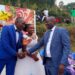 Ampeire Stephen Kasyaba, the Rubanda District LC.5 Chairman with a newly wed couple