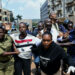 Ugandan police officers detain protestors during a rally against what the protesters say are rampant corruption and human rights abuses by the country's rulers in Kampala, Uganda July 23, 2024. REUTERS/Abubaker Lubowa