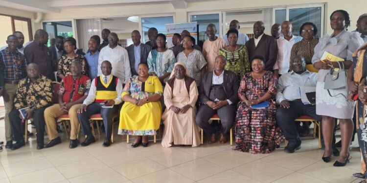 Minister Babalanda in a group photo with the workshop participants