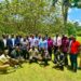 Journalists and radio presenters pose for a group photo after the Mbale meeting.