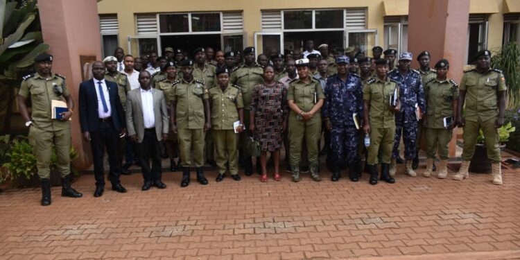 The Kiira Regional Police team with the chief SSP Charles Nsaba after a meeting in Jinja City.