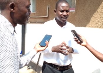 Mr. Buwembo Habib addressing Journalists after being aquited by City Hall Magistrates Court in Kampala on Tuesday