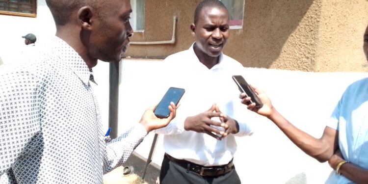 Mr. Buwembo Habib addressing Journalists after being aquited by City Hall Magistrates Court in Kampala on Tuesday