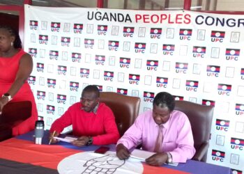 UPC Spokesperson Sharon Arach addressing Journalists in Kampala on Wednesday as the Head of UPC Media and Communications, Muzeyi Faizo and other Party officials listen on