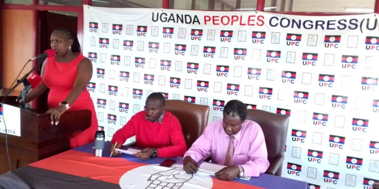 UPC Spokesperson Sharon Arach addressing Journalists in Kampala on Wednesday as the Head of UPC Media and Communications, Muzeyi Faizo and other Party officials listen on