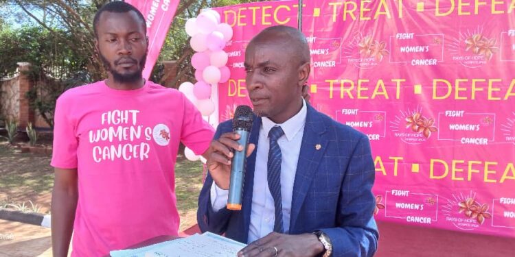 Dr Kibuuka Afizi the Deputy Director /Head of Clinical Department Jinja Regional Referral Hospital speaking during the Cancer Month.