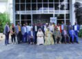 Hon. Babalanda in a group photo with the workshop participants