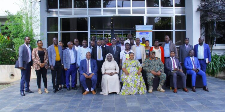 Hon. Babalanda in a group photo with the workshop participants