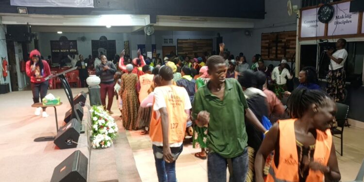 KCCA Cleaners holding prayers