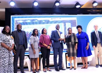 Andrew Kilonze Managing Director Uganda Breweries Limited (forth right) receiving an recognition award from Betty Among Minister of Gender, Labour and Social Development (Third right) during the for Gender Equality Seal Award Ceremony for private Sector companies at Serena Hotel on 8th December 2023. Photo by Ivan Kabuye.