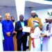 Haji Kirunda handing over a certificate to one of the participants