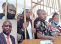 NUP prisoners who were recently pardoned by the President (in court martial dock and Haji Faruk Kirunda (inset)