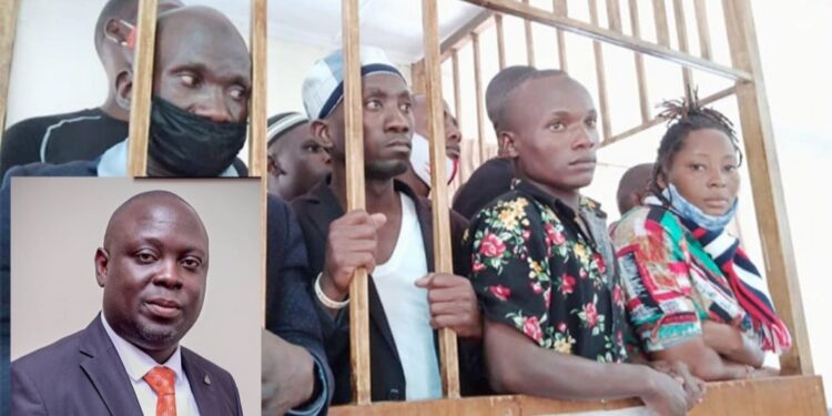 NUP prisoners who were recently pardoned by the President (in court martial dock and Haji Faruk Kirunda (inset)