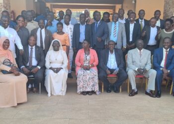 Haji Kakande in a group photo with officials from the Office of the President,RDCs ,DISOs and RISOs