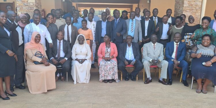 Haji Kakande in a group photo with officials from the Office of the President,RDCs ,DISOs and RISOs