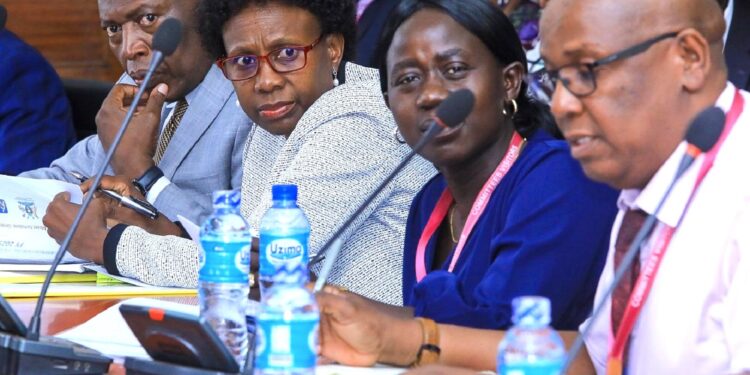 Hon. Jane Ruth Aceng (second left)