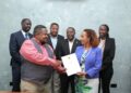 UTA President Yewagnesh Biriggwa aka Yogi(R) and other board members handing over the realms of UTA to Muhereza Kyamutetera.