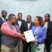 UTA President Yewagnesh Biriggwa aka Yogi(R) and other board members handing over the realms of UTA to Muhereza Kyamutetera.