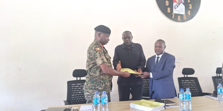 Hajji Kakande witnesses as Brig. Kisembo hands over office to Col. Rukogota