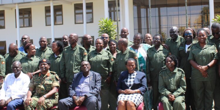 Hajji Kakande,  Ms. Lucy Nakyobe and the participants