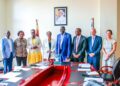 Hon. Eng. Hilary Onek (center), Ambassador Robie Kakonge (left), and UNHCR Country Representative Mr. Mathew Grentsil (right) pose for a photo.