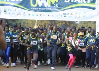 Hon. Martin Mugarra Bahinduka (front, 3rd from the right) was the chief runner