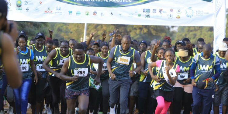 Hon. Martin Mugarra Bahinduka (front, 3rd from the right) was the chief runner