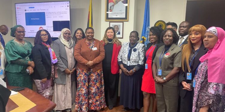 Hon. Babalanda in a group photo with other event attendees